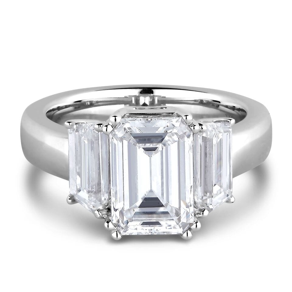 emerald cut diamond trilogy ring