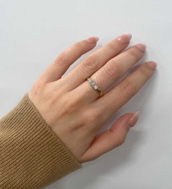 0.43 Carat TW 3-Stone Diamond Anniversary Ring in Yellow Gold