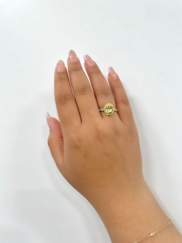1.85 Carat Oval Cut Yellow Sapphire and Diamond Halo Ring in 18K Yellow Gold
