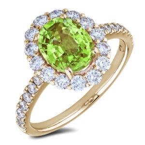 Oval Peridot and Canadian Diamond Halo Ring in Yellow Gold