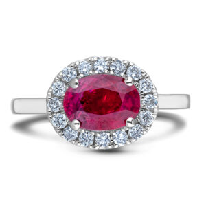Oval Shaped Ruby and Canadian Diamond Halo Ring in White Gold