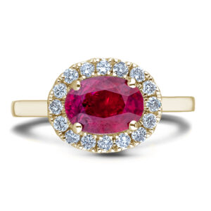 Oval Shaped Ruby and Canadian Diamond Halo Ring in Yellow Gold