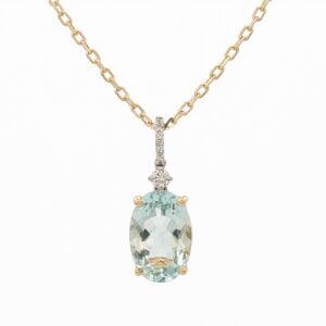 Canadian Diamond and Oval Shaped Aquamarine Pendant in Yellow and White Gold